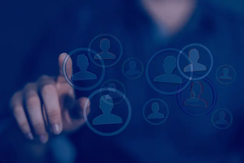 A hand reaches toward a translucent screen where circles containing person icons overlap at different sizes, suggesting duplicate customer records resolving into clusters