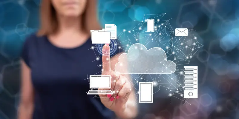Woman touching a virtual cloud computing interface connecting devices, servers, files and email — representing cloud data platform usage and the compute costs it generates